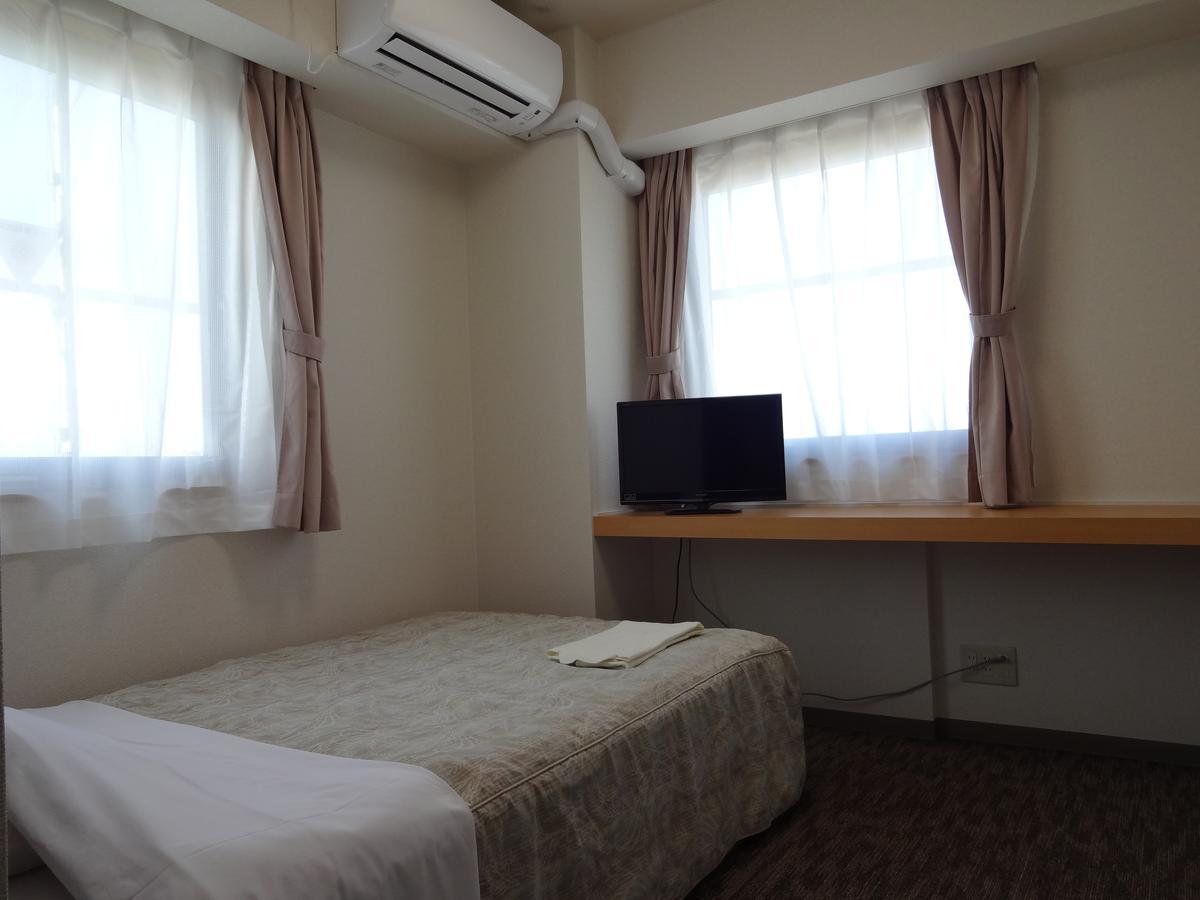Ushiku City Hotel Ekimaekan Buitenkant foto