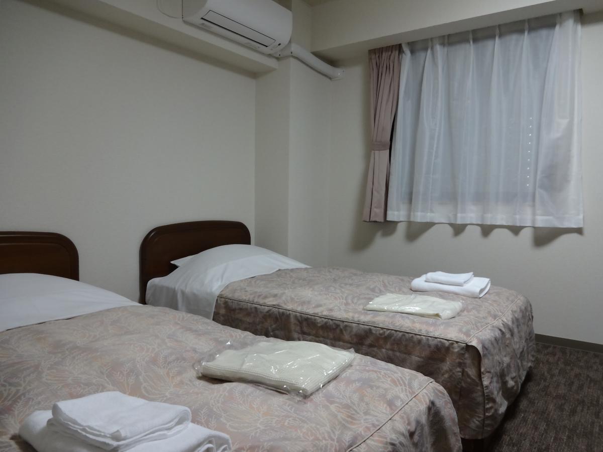 Ushiku City Hotel Ekimaekan Buitenkant foto